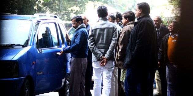 NEW DELHI, INDIA - DECEMBER 24: Delhi Chief Minister, Arvind Kejriwal, getting into his old Maruti wagon R, after meeting the LT governor in Delhi, on December 24, 2013 in New Delhi, India. Making spectacular electoral debut, newly formed AAP emerged as the second-largest party in Delhi winning 28 of the 70 Assembly seats. (Photo by Ramesh Pathania/Mint via Getty Images)