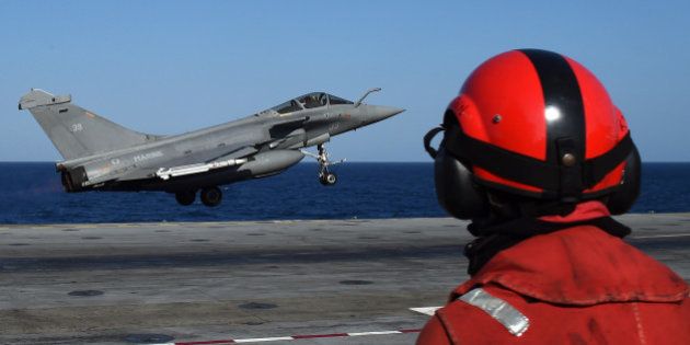 A French Rafale fighter aircraft carrying bombs is catapulted off French aircraft carrier Charles-de-Gaulle, on November 23, 2015 at eastern Mediterranean sea, as part of operation Chammal in Syria and Iraq against the Islamic State (IS) group. AFP PHOTO / ANNE-CHRISTINE POUJOULAT / AFP / ANNE-CHRISTINE POUJOULAT (Photo credit should read ANNE-CHRISTINE POUJOULAT/AFP/Getty Images)