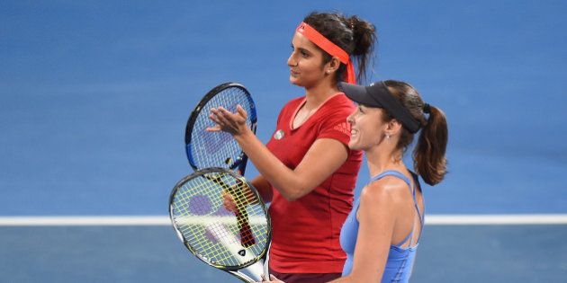 BRISBANE, AUSTRALIA - JANUARY 09: Sania Mirza of India and Martina Hingis of Switzerland celebrate winning in the Women's Doubles Final against Angelique Kerber and Andrea Petkovic of Germany during day seven of the 2016 Brisbane International at Pat Rafter Arena on January 9, 2016 in Brisbane, Australia. (Photo by Matt Roberts/Getty Images)