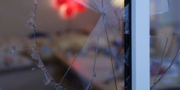 Close up of broken glass in window