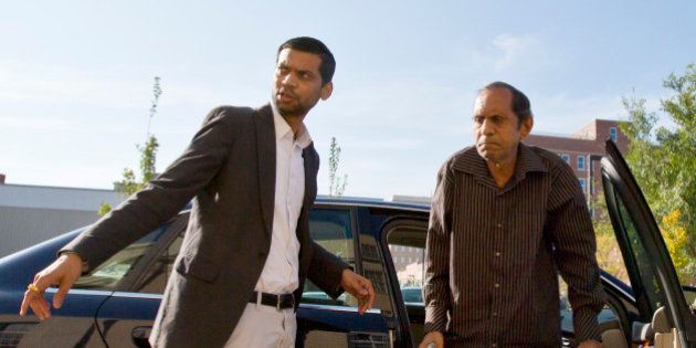 FILE - In this Tuesday, Sept. 1, 2015, file photo, Chirag Patel helps his father, Sureshbhai Patel, out of the car as they arrive outside the federal courthouse before start of a trial against Madison, Ala., police Officer Eric Sloan Parker, in Huntsville, Ala. Sureshbhai Patel, who was visiting relatives from his native India in February, was walking in his son's neighborhood when police responding to a call about a suspicious person stopped to question him. A police video captured an officer slamming the man to the ground, partially paralyzing him. The story was one of the top news items for Alabama in 2015. (AP Photo/Brynn Anderson, File)
