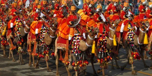 A camel mounted contingent of Border Security Force plays music during the final rehearsal of Republic Day parade in New Delhi, India, Monday, Jan. 23, 2012. (AP Photo/Saurabh Das)