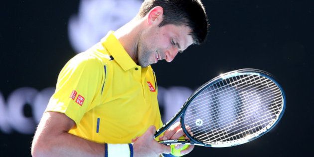 MELBOURNE, AUSTRALIA - JANUARY 18: Novak Djokovic of Serbia reacts in his first round match against Hyeon Chung of Korea during day one of the 2016 Australian Open at Melbourne Park on January 18, 2016 in Melbourne, Australia. (Photo by Quinn Rooney/Getty Images)