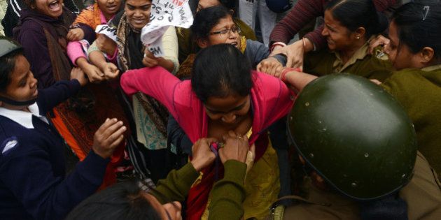 Leftist student activists tussle with police prior to getting arrested during a protest rally in Kolkata following the suicide of Rohit Vemula, a doctarate student at the Hyderabad Central University, on January 20, 2016. Rohit, a second-year PhD student of Life Sciences was found hanging in his hostel room after he was suspended from the college due to a political dispute. AFP PHOTO/DIBYANGSHU SARKAR / AFP / DIBYANGSHU SARKAR (Photo credit should read DIBYANGSHU SARKAR/AFP/Getty Images)