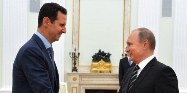 Russian President Vladimir Putin (R) shakes hands with his Syrian counterpart Bashar al-Assad (L) during their meeting at the Kremlin in Moscow on October 20, 2015. Syria's embattled President Bashar al-Assad made a surprise visit to Moscow on October 20 for talks with Russian President Vladimir Putin, his first foreign trip since the conflict erupted in 2011. AFP PHOTO / RIA NOVOSTI / KREMLIN POOL / ALEXEY DRUZHININ (Photo credit should read ALEXEY DRUZHININ/AFP/Getty Images)