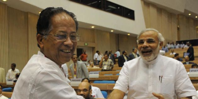 India's Gujarat state Chief Minister Narendra Modi (R) shakes hands with Assam state Chief Minister Tarun Gogoi (L) during the inauguration of the Joint Conference of Chief Ministers of the States and Chief Justices of the High Courts in New Delhi on August 16, 2009. While speaking at the Joint Conference of Chief Ministers and Chief Justices Indian Prime Minister Manmohan Singh said that the elimination of vast number of pending cases in the Indian Courts is the biggest challenge before the judiciary and called upon the judiciary and executive to work together to make the Indian judicial system an arrear free. AFP PHOTO/ Prakash SINGH (Photo credit should read PRAKASH SINGH/AFP/Getty Images)