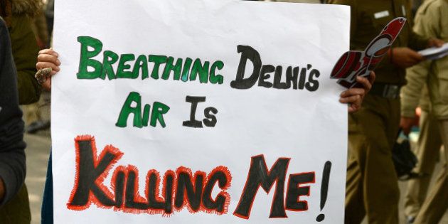 Social activists hold placards during an awareness rally against air pollution under the banner, 'Help Delhi Breathe' in New Delhi on January 17, 2016. Dozens of Delhi residents took part in the rally to raise awareness about the harmful impact of Delhi's air and push for solutions. AFP PHOTO / SAJJAD HUSSAIN / AFP / SAJJAD HUSSAIN (Photo credit should read SAJJAD HUSSAIN/AFP/Getty Images)