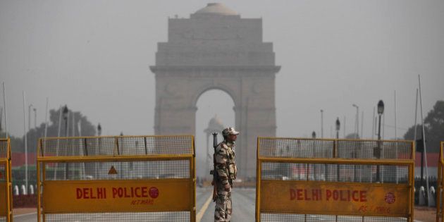 An Indian paramilitary soldier stands guard near a police barricade in front of India Gate, the landmark war memorial on Rajpath, the ceremonial boulevard for Republic Day parade in New Delhi, India, Thursday, Jan. 21, 2016. Security has been beefed up across India ahead of the Republic Day celebrations on Jan. 26, when French President Francois Hollande will be the chief guest. (AP Photo/Altaf Qadri)