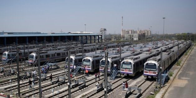 Metro coaches that will run on the Badarpur-Faridabad extension of the Delhi Metro are seen at a depot on the outskirts of New Delhi, India, Thursday, April 9, 2015. The line, which will be an extension of the currently operational violet line between Mandi House and Badarpur will take the Metro to the satellite city of Faridabad in Haryana for the first time, a Delhi Metro Rail Corporation press release said. (AP Photo/Altaf Qadri)