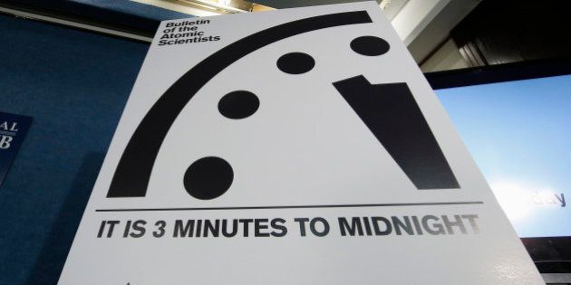 A sign showing the 'Doomsday Clock' that remains at three minutes to midnight is seen after it was unveiled by the Bulletin of the Atomic Scientists, Tuesday, Jan. 26, 2016, during a news conference at the National Press Club in Washington. The clock was last moved January 2015, from five minutes to three minutes before midnight, the closest it has been to catastrophe since the days of hydrogen bomb testing. (AP Photo/Alex Brandon)