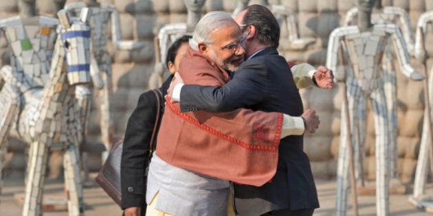 Indian Prime Minister Narendra Modi, left and French President Francois Hollande greet each other at the Rock Garden in Chandigarh, India, Sunday, Jan. 24, 2016. Hollande began a three-day visit to India on Sunday that could push a multibillion-dollar deal for combat airplanes and closer cooperation on counterterrorism and clean energy. (AP Photo/Manish Swarup)