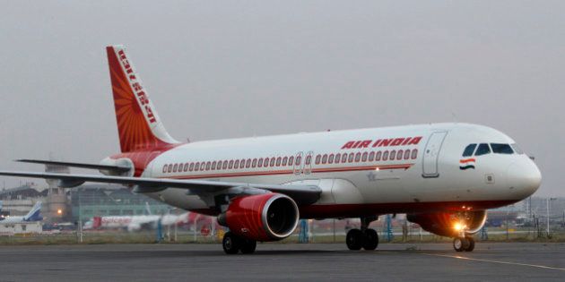 An Air India plane taxies at the Indira Gandhi International airport in New Delhi, India in New Delhi, India, Friday, May 11, 2012. Hundreds of passengers have been stranded in India after Air India canceled around 20 international flights due to a strike by pilots. (AP Photo/ Mustafa Quraishi)