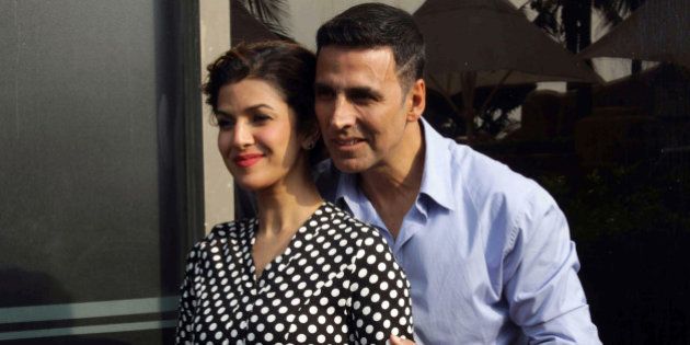 Indian Bollywood actors Akshay Kumar (R) and Nimrat Kaur pose during the media interaction of their upcoming Hindi film 'Airlift' directed by Raja Krishna Menon in Mumbai on January 15, 2016. AFP PHOTO / AFP / STR (Photo credit should read STR/AFP/Getty Images)