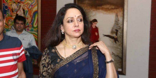 NEW DELHI, INDIA - JUNE 28: Bollywood actor Hema Malini at the Exhibition Ganpati & Chromophore by Artists Seema Chaudhary and Nitin Chaudhary at Open Palm Court Gallery, IHC on June 28, 2013 in New Delhi, India. (Photo by Prabas Roy/Hindustan Times via Getty Images)