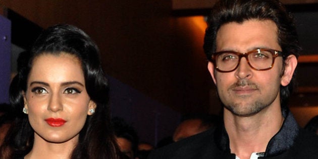 Indian Bollywood actors Hrithik Roshan (R) and Vivek Oberoi (L) pose with actress Kangana Ranaut (C) during a promotional event for the forthcoming Hindi film Krrish 3 Halloween party in Mumbai late October 30, 2013. AFP PHOTO/STR (Photo credit should read STRDEL/AFP/Getty Images)