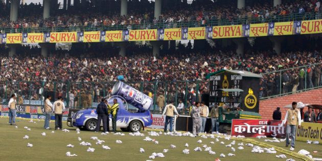 Rolled seat covers are seen lying on the ground after spectators threw them in protest after the fifth and final one-day international cricket match between India and Sri Lanka was abandoned at the Feroz Shah Kotla stadium in New Delhi, India, Sunday, Dec. 27, 2009. A dangerous pitch caused the match to be abandoned. (AP Photo/Aijaz Rahi)