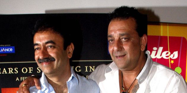 Indian Bollywood film actor and cast member of Hindi film 'Lage Raho Munna Bhai', Sanjay Dutt (R) and film director Rajkumar Hirani attend producer-director Vidhu Vinod Chopraâs 'A Film Festival' in Mumbai late March 31, 2012. AFP PHOTO/STR (Photo credit should read STRDEL/AFP/Getty Images)