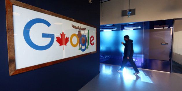 An employee walks in a hallway at Google Canada's engineering headquarters in Waterloo, Ontario, Canada, on Friday, Jan. 22, 2016. The 185,000-square-foot facility currently houses over 350 employees from Google's Canadian development team. Photographer: Cole Burston/Bloomberg via Getty Images