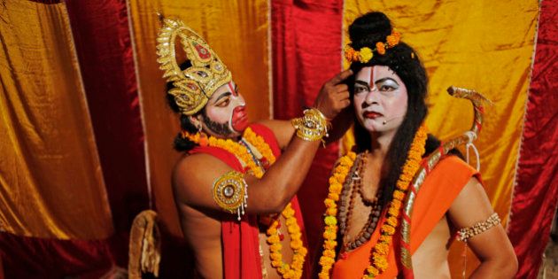 In this Sunday, Sept. 28, 2014 photo, Indian artists prepare themselves before going on stage for a traditional Ramleela drama, narrating the life of Hindu God Rama, to celebrate the festival of Dussehra in Allahabad, India. The Hindu festival of Dussehra commemorates the triumph of Lord Rama over the demon king Ravana, marking the victory of good over evil. (AP Photo/Rajesh Kumar Singh)