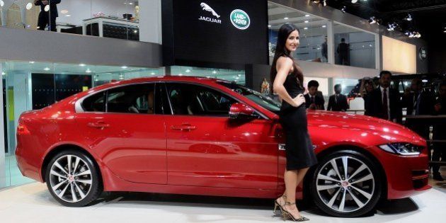 DELHI, INDIA - FEBRUARY 3: Bollywood actress Katrina Kaif poses with the Jaguar XE during its launch at the Indian Auto Expo in Greater Noida, on the outskirts of Delhi , February 03, 2016. (Photo by Imtiyaz Khan/Anadolu Agency/Getty Images)