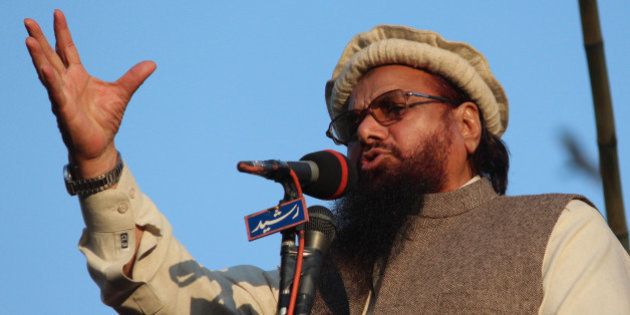 LAHORE, PUNJAB, PAKISTAN - 2015/01/18: Hafiz Saeed, head of the banned Islamic charity Jamat-ud-Dawa, addresses demonstrators during a rally against a decision by the controversial French magazine 'Charlie Hebdo' to publish a depiction of the Prophet Muhammad. Around 10,000 people rallied against French magazine Charlie Hebdo, banning for militant links and urged protesters to boycott French products in Pakistan. (Photo by Rana Sajid Hussain/Pacific Press/LightRocket via Getty Images)