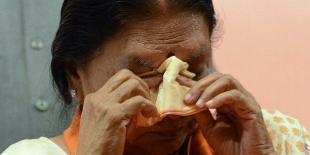 Gujarat's first woman chief minister, Anandiben Patel gets emotional during a meeting at the Town Hall in Gandhinagar, some 30 kms from Ahmedabad on May 21, 2014. Anandiben Patel was termed as the new Gujarat chief minister and will take the oath on May 22 in Gandhinagar. AFP PHOTO / Sam PANTHAKY (Photo credit should read SAM PANTHAKY/AFP/Getty Images)