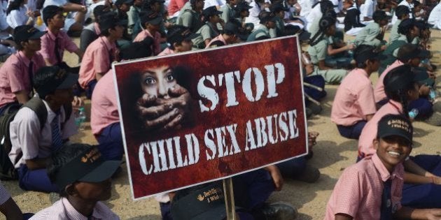 Indian school students participate in an awareness Campaign against Child Sex Abuse (CSA) in Hyderabad on November 19, 2014, the World Day for Prevention of Child Abuse. More than 53 percent of children in India have faced sexual abuse, according to reports. AFP PHOTO / Noah SEELAM (Photo credit should read NOAH SEELAM/AFP/Getty Images)