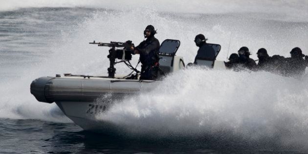 Indian naval commandos show their prowess during the International Fleet Review in Vishakapatnam, India, Saturday, Feb. 6, 2016. Indian President Pranab Mukherjee, who is the supreme commander of the Indian armed forces, reviewed a fleet of over 90 naval ships including several from foreign countries. (AP Photo/Saurabh Das)