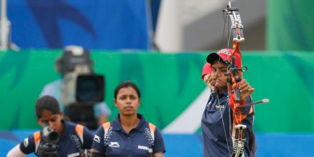 From left, India's team members Purvasha Sudhir Shende, Trisha Deb and Jyothi Surekha Vennam compete during the compound women's team gold medal archery match at the 17th Asian Games in Incheon, South Korea, Saturday, Sept. 27, 2014. (AP Photo/Kin Cheung)