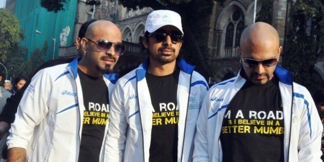 Indian Bollywood celebrity MTV Roadies pose during the Standard Chartered Mumbai Marathon (SCMM) 2012 in Mumbai on January 15, 2012. AFP PHOTO/STR (Photo credit should read STRDEL/AFP/Getty Images)