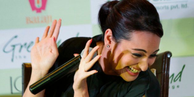 Bollywood actress Sonakshi Sinha gestures during a promotional event of her forthcoming movie