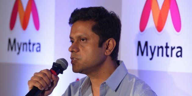 CEO of Myntra and Head of Commerce, Flipkart, Mukesh Bansal addresses the media during a press conference to announce Myntra's transition to an 'app only' platform, in Bangalore on May 12, 2015. Myntra, e-commerce platform for fashion and lifestyle products will become a mobile app only 'etail' business from May 15, targetting 5 million app downloads in the next four months. AFP PHOTO/ Manjunath KIRAN (Photo credit should read Manjunath Kiran/AFP/Getty Images)