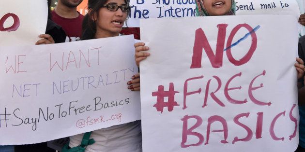 Indian demonstrators of Free Software Movement Karnataka hold placards during a protest against Facebook's Free Basics initiative, in Bangalore on January 2, 2016. The group's demonstration was aimed at urging members of the public to say 'no to free basics' which they allege will affect net neutrality and give Facebook monopoly over the internet. AFP PHOTO/ Manjunath KIRAN / AFP / MANJUNATH KIRAN (Photo credit should read MANJUNATH KIRAN/AFP/Getty Images)
