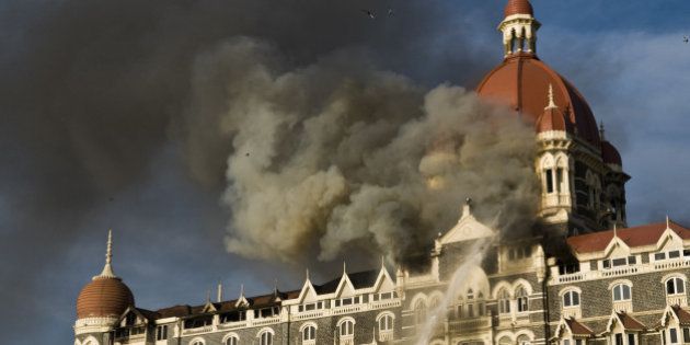 Firefighters try to douse fire started by terror attack at Taj Mahal Palace and Tower hotel in Mumbai.