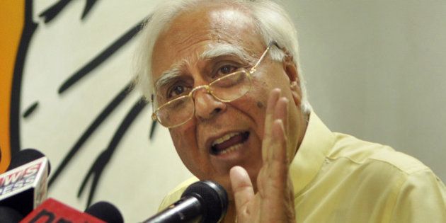 NEW DELHI, INDIA - APRIL 16: Congress leader Kapil Sibal addressing the media persons about the expenditure being spent on Narendra Modi's rally and advertisements at AICCI office on April 16, 2014 in New Delhi, India. Congress alleged that whopping Rs 5,000 is spend on poll campaign of BJP prime ministerial candidate. It claims that most of it is black money and sought a probe into the origin of these funds. (Photo by Sushil Kumar/Hindustan Times via Getty Images)
