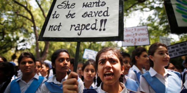 Indian students shout slogans as they hold placards demanding stringent punishment to rapists during a protest in New Delhi, India, Tuesday, April, 23, 2013. A second suspect was arrested Monday in the rape of a 5-year-old girl who New Delhi police said was left for dead in a locked room, a case that has brought a new wave of protests against how Indian authorities handle sex crimes. (AP Photo/ Saurabh Das)