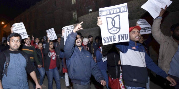 NEW DELHI, INDIA - FEBRUARY 12: JNU teachers and students protest march inside JNU Campus against arrest of JNU students union president Kanhaiya Kumar on February 12, 2016 in New Delhi, India. JNU students union president Kanhaiya Kumar was arrested on in connection with a case of sedition and criminal conspiracy over holding of an event at the prestigious institute against hanging of Parliament attack convict Afzal Guru in 2013. A group of students on Tuesday held an event on the JNU campus and allegedly shouted slogans against India. (Photo by Arun Sharma/Hindustan Times via Getty Images)