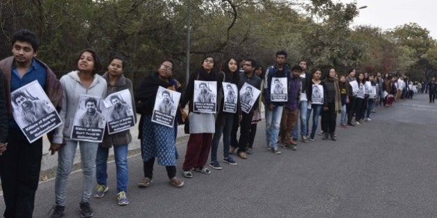 NEW DELHI, INDIA - FEBRUARY 14: JNU teachers and students form a human chain inside the campus in protest against arrest of JNU Student's Union president Kanhaiya Kumar, demand the release of Kanhaiya Kumar who was arrested on sedition charge in connection with an event organised on the campus against the hanging of Afzal Guru, at JNU campus, on February 14, 2016 in New Delhi, India. Jawaharlal Nehru University (JNU) teachers association said that they have never supported any unconstitutional activity inside the campus and have always opposed it. Kanhaiya Kumar was arrested in connection with a case of sedition, seven more students from the university have been detained after a controversial event to protest the hanging of 2001 Parliament attack convict Afzal Guru three years ago. The protesters also allegedly shouted anti-India slogans during the event. (Photo by Sanjeev Verma/Hindustan Times via Getty Images)