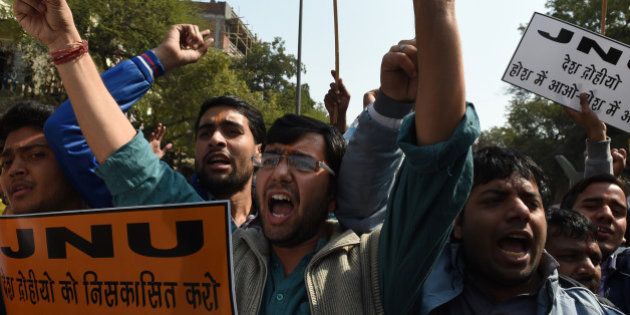 Indian right-wing activists shout slogans during a protest outside Jawaharlal Nehru University (JNU) in New Delhi on February 16, 2016. A student union leader Kanhaiya Kumar was arrested on Friday for allegedly shouting anti-India slogans at a rally in protest against a Kashmiri separatist's execution three years ago. AFP PHOTO / Money SHARMA / AFP / MONEY SHARMA (Photo credit should read MONEY SHARMA/AFP/Getty Images)