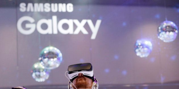 People wear Samsung Gear VR sets during a virtual reality demonstration at CES International Wednesday, Jan. 6, 2016, in Las Vegas. (AP Photo/Gregory Bull)