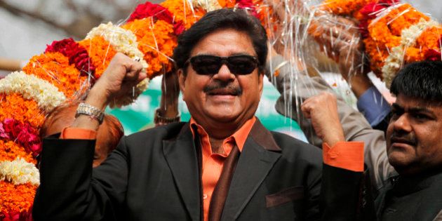 Bharatiya Janata Party leader and Bollywood actor Shatrughan Sinha, is garlanded in an election campaign rally in Allahabad, India, Monday, Feb. 13, 2012. India's largest state Uttar Pradesh is currently going to the polls in seven-phases in a month long local election with repercussions for the whole nation. (AP Photo/Rajesh Kumar Singh)