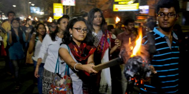 Students of Jadavpur University march in a torch light procession protesting against the arrest of a student union leader of New Delhi's Jawaharlal Nehru University in Kolkata, India, Tuesday, Feb. 16, 2016. Students, journalists and teachers protested in the Indian capital Tuesday after a student union leader's arrest and subsequent violence by Hindu nationalists. (AP Photo/ Bikas Das)