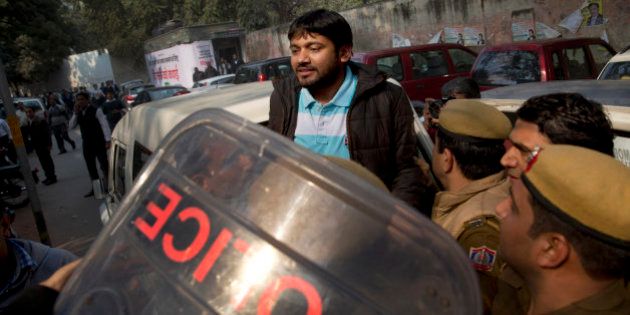 Kanhaiya Kumar, the president of the students' union at the country's premier Jawaharlal Nehru University is produced at a Delhi court, in New Delhi, India, Wednesday, Feb. 17, 2016. Dozens of lawyers, many with links to India's ruling nationalist party, clashed Wednesday with protesters demanding the release of the student leader arrested under India's colonial-era sedition laws. (AP Photo/Tsering Topgyal)