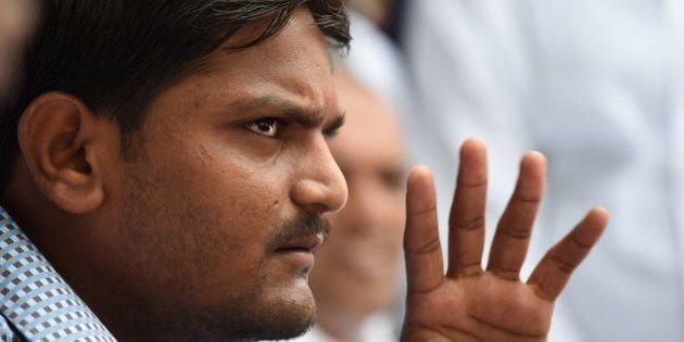 Indian convenor of the 'Patidar Anamat Andolan Samiti', Hardik Patel, who led recent protests in the state of Gujarat demanding preferential treatment regarding jobs and university places for the Patidar caste, speaks during a press conference in New Delhi on August 30, 2015. A firebrand protest leader vowed August 30 to spread agitation over caste preferences nationwide, just days after the worst violence in more than a decade in western India left nine people dead. AFP PHOTO / SAJJAD HUSSAIN (Photo credit should read SAJJAD HUSSAIN/AFP/Getty Images)