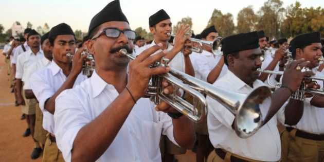 Members of Hindu nationalist Rashtriya Swayamsevak Sangh (RSS) or the National Volunteers Association brass band perform during the concluding event of their four day camp in Bangalore, India, Sunday, Jan. 10, 2016. About 2000 RSS members who can play brass band instruments participated in the event. Hindus, make up more than 80 percent of India's population of 1.25 billion. (AP Photo/Aijaz Rahi)