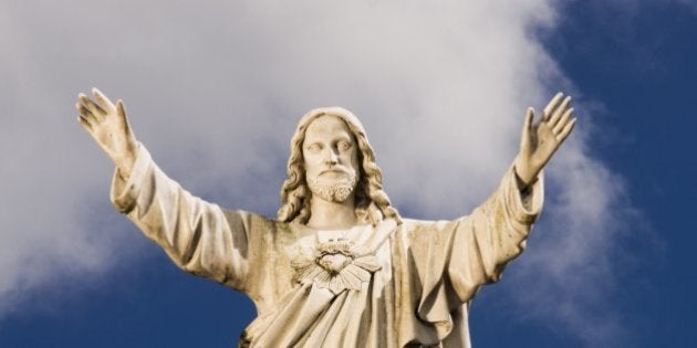 Statue of Jesus against sky