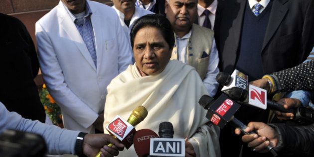 NEW DELHI, INDIA - DECEMBER 21: Mayawati Supremo BSP talking to media personnel after Rajya Sabha passes SC/ST Bill, supplementary demands without debate during the Winter Session of the Parliament at Parliament House on December 21, 2015 in New Delhi, India. As pressure mounted on it for early passage of the Juvenile Justice Bill, the government today listed the crucial legislation in Rajya Sabha for passage tomorrow and blamed Congress for blocking it in the past due to its obstructionist politics even when it was listed on 15 occasions. (Photo by Vipin Kumar/Hindustan Times via Getty Images)