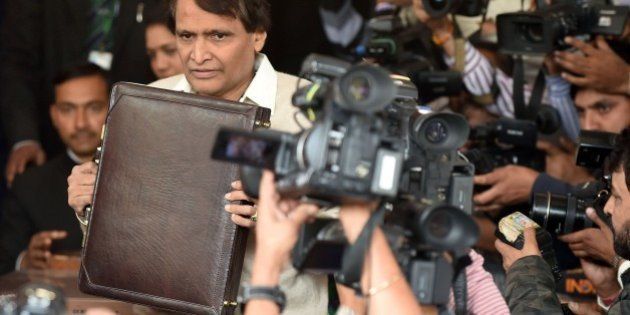 Indian Railways Minister Suresh Prabhu poses for media representatives as he arrives at Parliament House to table the Railway Budget in New Delhi on February 25, 2016. AFP PHOTO / Prakash SINGH / AFP / PRAKASH SINGH (Photo credit should read PRAKASH SINGH/AFP/Getty Images)
