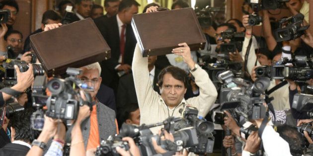 NEW DELHI, INDIA - FEBRUARY 25: Indian Railway Minister Suresh Prabhu arrives at Parliament for presenting the Railway Budget along with MOS Manoj Sinha, on February 25, 2016 in New Delhi, India. Talking to the reporters on this occasion, Prabhu said that the Rail Budget will cater to the needs of all satisfactorily as a lot of effort has gone into its preparation. (Photo by Mohd Zakir/Hindustan Times via Getty Images)