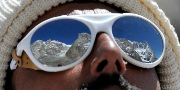 A Pakistani soldier wearing sunglasses looks on at the avalanche site during an ongoing operation at Gayari camp near the Siachen glacier on April 18, 2012. Rescuers are still searching for nearly 140 soldiers buried by the mass of snow and rock at Gayari camp near the Siachen glacier, 4,000 metres above sea level. More than 450 rescuers are working at the site near the de facto border with India in the militarised region of Kashmir, though experts have said there is virtually no chance of finding any survivors. AFP PHOTO / AAMIR QURESHI (Photo credit should read AAMIR QURESHI/AFP/Getty Images)